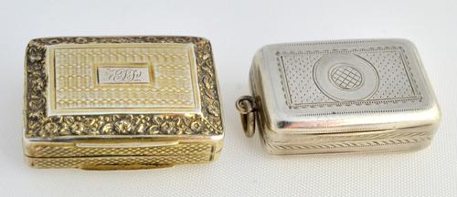 A silver gilt rectangular vinaigrette, with a scroll and foliate pierced grille, the exterior engine turned within floral and foliate borders, by John