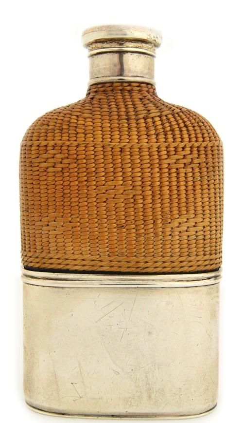 A William IV silver and woven rushwork mounted glass spirit flask, with a silver pull-off plain beaker base, London 1834.  Illustrated