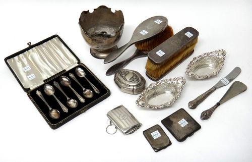Silver and silver mounted wares, comprising; a bowl, having a shaped rim, a set of six coffee spoons, Birmingham 1942, cased, two hairbrushes, two clo