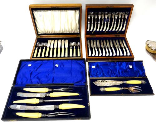 A set of twelve pairs of plated dessert or fruit knives and forks, with mother of pearl handles, with a wooden case, a set of six pairs of plated fish