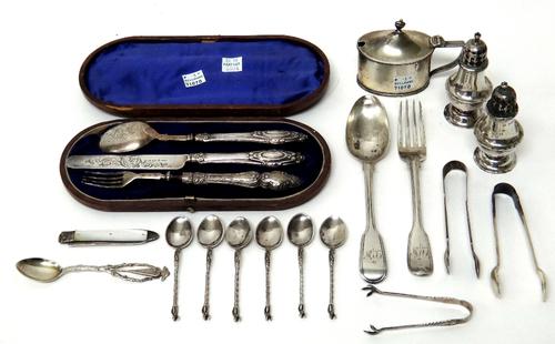 Silver and silver mounted wares, comprising; an oval mustard pot with a blue glass liner, Chester 1907, a pair of condiments, a three piece christenin