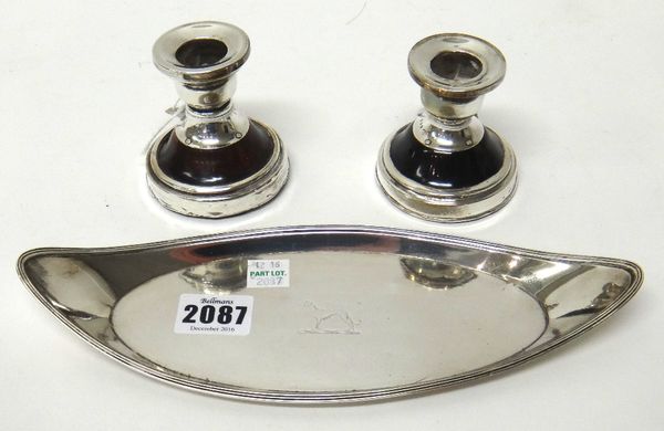 A George III silver oval candle snuffers tray, crest engraved within a reeded rim, London 1792, weight 123gms and a pair of silver and tortoiseshell s