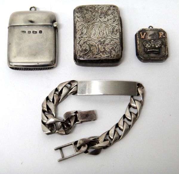 Silver, comprising; a rectangular vesta case, Birmingham 1901, a Victorian rectangular vesta box, Birmingham 1897, a Victorian rectangular locket, Bir