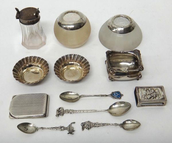 Silver and silver mounted wares, comprising; two ribbed glass match strikers, a rectangular book matches case, Birmingham 1926, a pair of circular sma