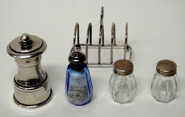 Silver and silver mounted wares, comprising; a small five bar toastrack, with a loop shaped handle, London 1924, a pepper mill, London 1901, a pair of