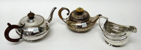 A silver small teapot, of circular form, with fluted decoration, the lower part of the teapot London 1820, the associated lid, London 1887, a silver h