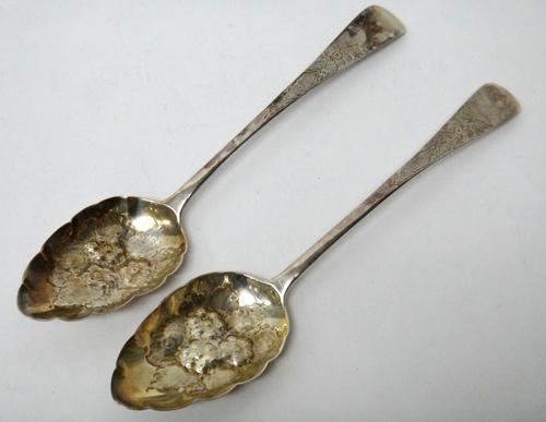 A pair of silver berry fruit serving spoons, with later embossed decoration, London 1829, weight 82 gms.
