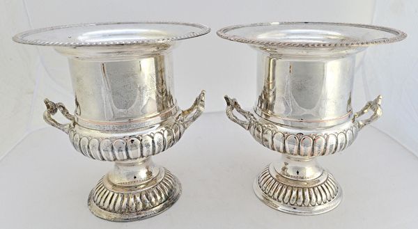 A pair of plated on copper twin handled wine coolers, of campana form, with partly fluted decoration and decorated with gadrooned borders to the flare