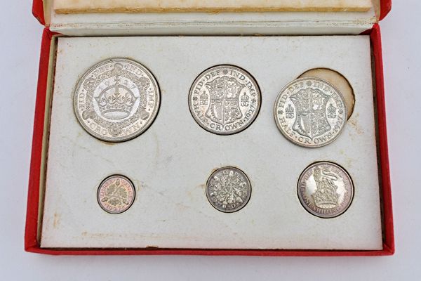 A George V 1927 part specimen coin set of five coins, including the wreath crown, but lacking the florin and an additional 1927 half crown, with the o