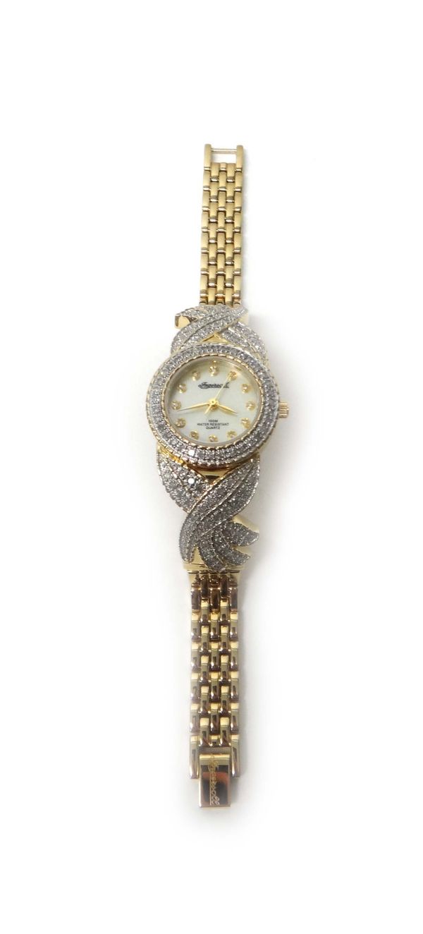 A lady's gilt metal and diamond set Ingersoll Quartz dress bracelet wristwatch, the signed circular mother of pearl dial with diamond set numerals, th