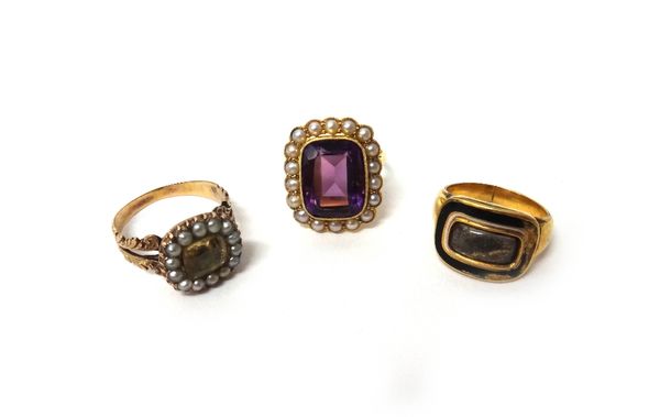 A gold, amethyst and seed pearl set cluster ring, mounted with the cushion shaped amethyst to the centre, within a surround of seed pearls, an early 1