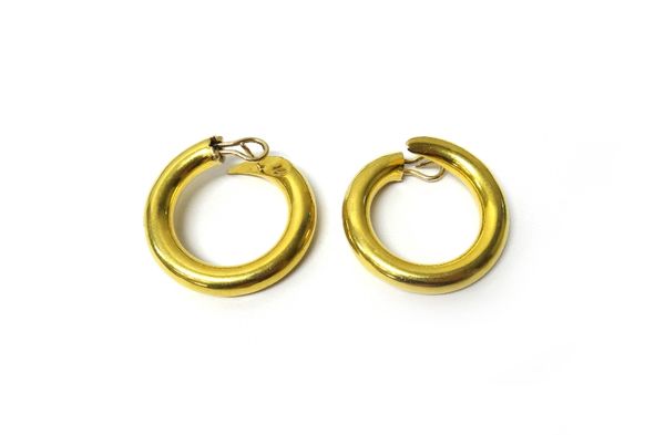 A pair of gold earclips, each of plain circular form, with post and folding clip fittings, detailed 750, gross weight 19.6 gms.