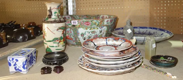 A quantity of Oriental ceramics, including a large famille rose bowl, (a.f.), Imari decorated plates, figures and sundry.  S1T