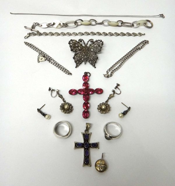 A foil backed pink gem set pendant cross, a faceted steel finial from a lady's hair ornament, designed as a butterfly, and mostly silver jewellery, co