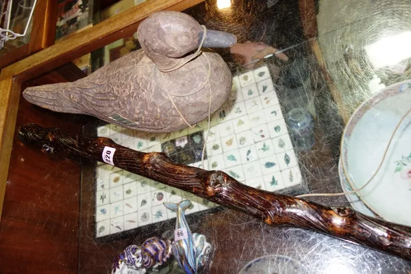 An early 20th century decoy duck and an elm staff. (2)   CAB