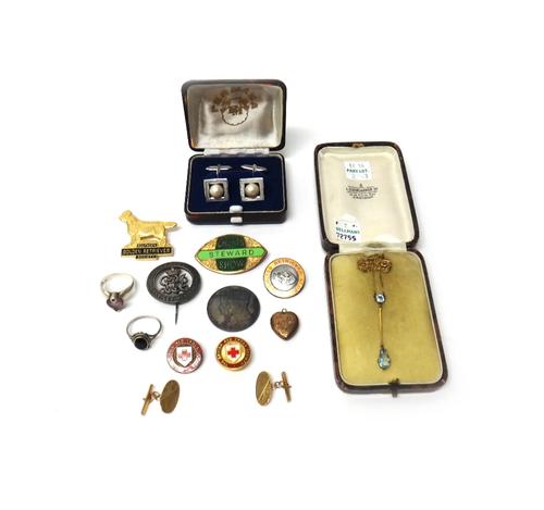 A gold and pale blue gem set pendant necklace, detailed 9 CT, with a case, a pair of 9ct gold cufflinks, having oval fronts and with bar fittings at t