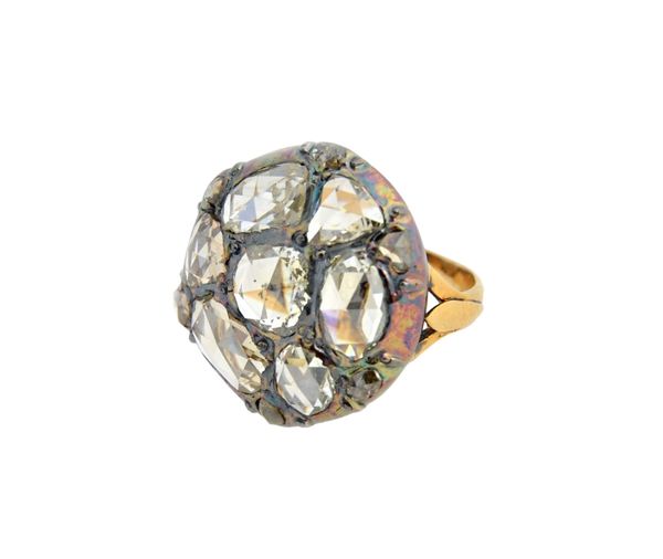 A gold and silver set rose diamond set circular large cluster ring, mounted with seven principal variously cut rose diamonds and with six smaller rose