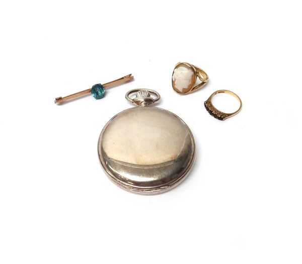 A gold bar brooch, claw set with a cushion shaped blue zircon, a 9ct gold and garnet set five stone ring, a gold ring, mounted with an oval shell came