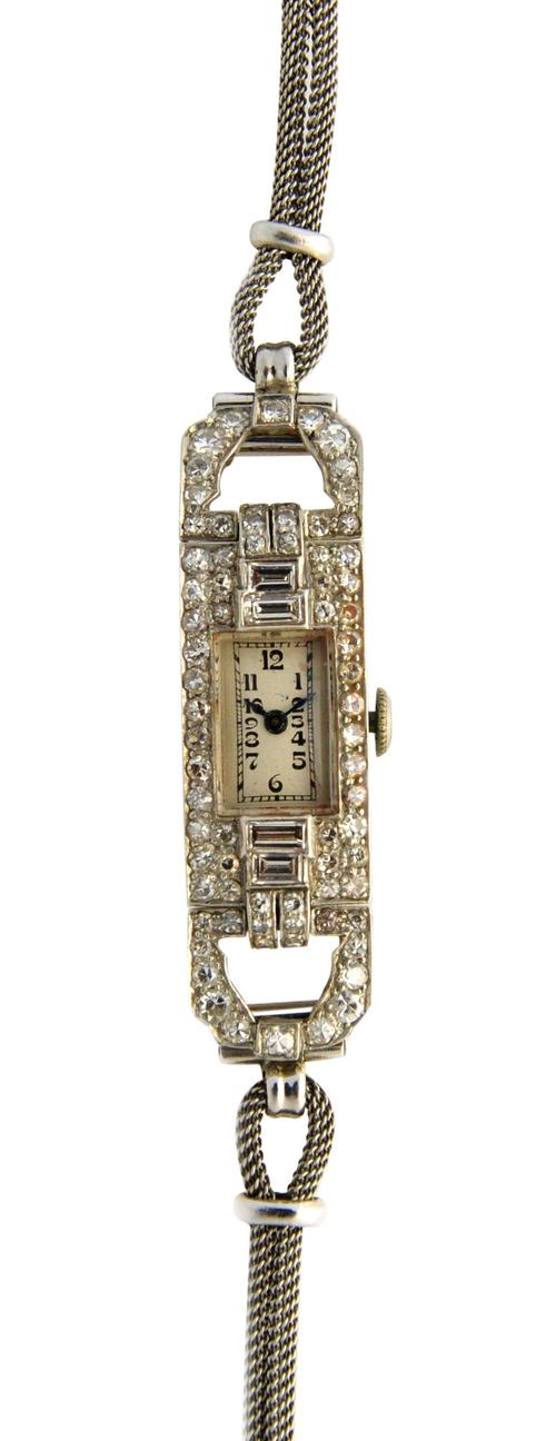 A Mappin & Webb lady's diamond set rectangular cased dress wristwatch, with an oval Swiss jewelled movement, the rectangular silvered dial with black