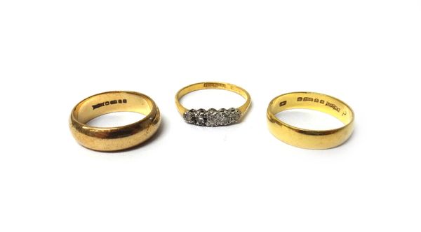 A gold and platinum, diamond set five stone ring, detailed 18 CT & PLAT, an 18ct gold wedding ring, weight 3.3 gms and a 9ct gold wedding ring, weight