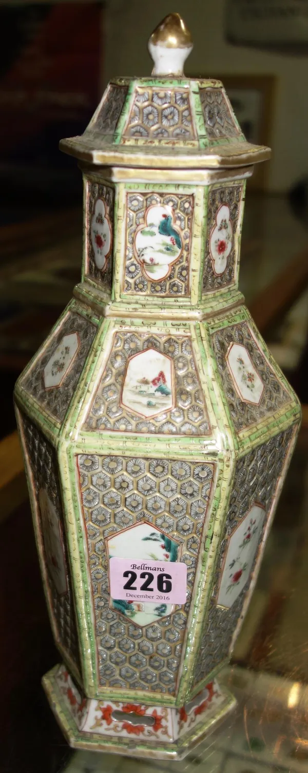 A 19th century Chinese six sided vase and cover decorated with floral panels. CAB