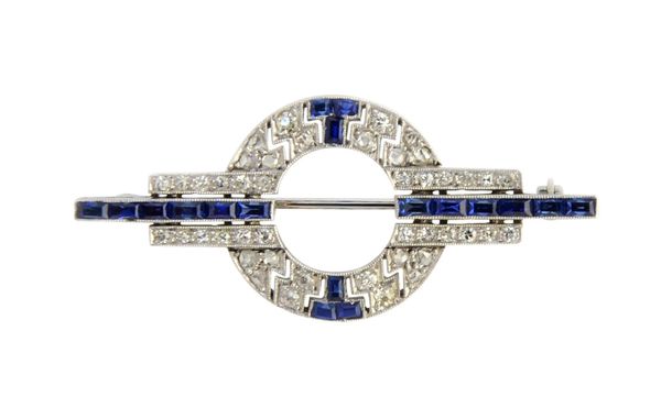 A sapphire and diamond brooch, in a geometric and circular design, mounted with cushion shaped and rose cut diamonds and with calibre cut sapphires, w