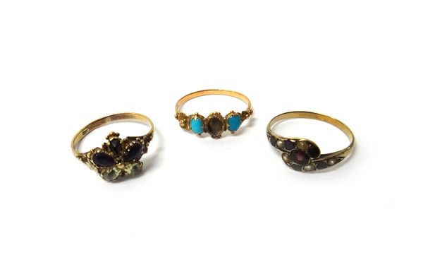 A Victorian amethyst, garnet and chrysolite set cluster ring, designed as a flowerhead, a gold, garnet and seed pearl set ring, in a twistover design