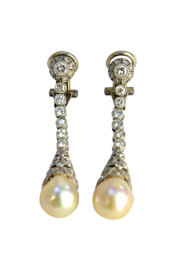 A pair of diamond and cultured pearl pendant earrings, each with a diamond capped single cultured pearl drop, connected by a row of six circular cut d