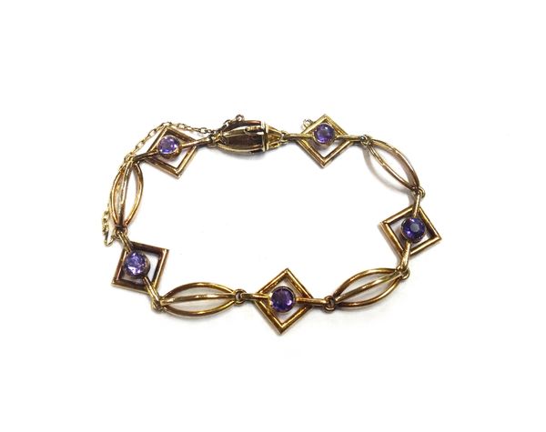 A gold and amethyst bracelet, formed as a series of square openwork links centred by circular cut amethysts, alternating with curved triple bar shaped