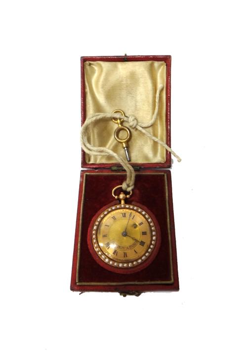 A lady's gold cased and seed pearl set, key wind, openfaced French fob watch, the gilt movement detailed Bourbon Palais Royal, the signed gilt dial wi