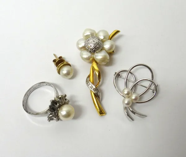 A cultured pearl set dress ring, detailed White Gold, a cultured pearl set brooch, designed as a flower spray, detailed 14 K, a cultured pearl brooch,