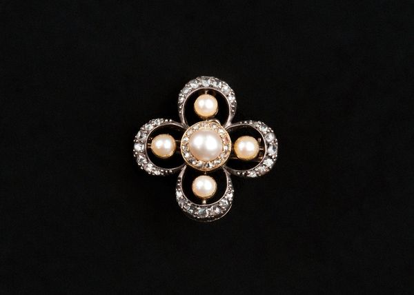 A gold backed and silver fronted rose diamond and cultured pearl brooch, pierced in a quatrefoil shaped design, mounted with the principal cultured pe