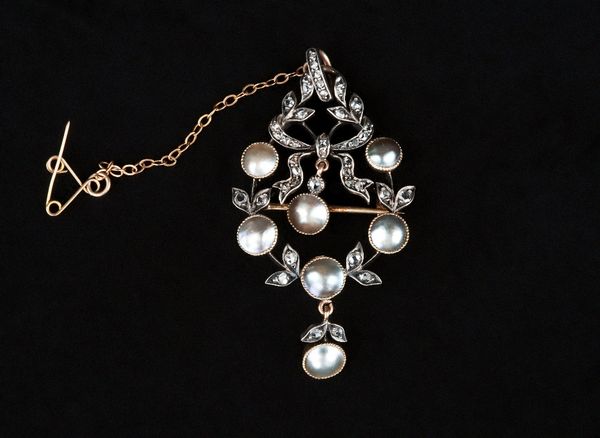 A rose diamond and blister pearl set pendant brooch, in a wreath and bow design, the front having a pendant drop, mounted with rose cut diamonds and w