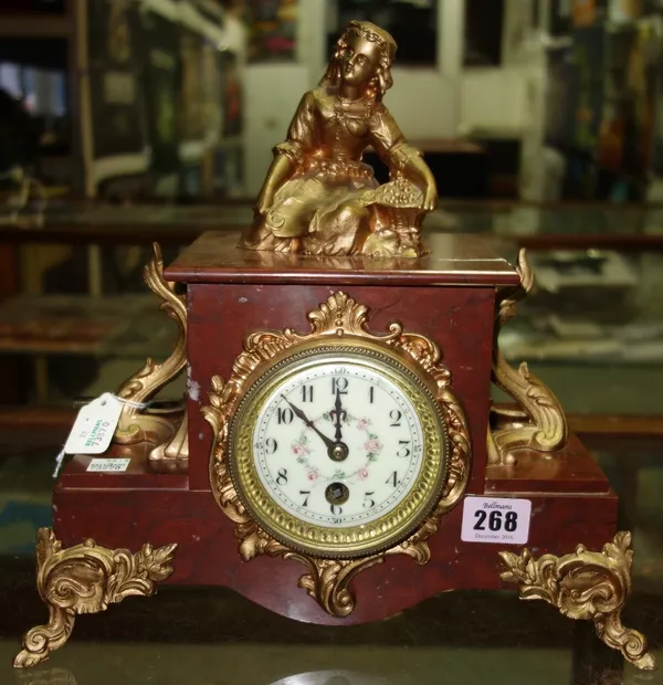 A French marble and spelter mounted mantel clock, late 19th century, the gilt spelter figure emblematic of the seasons, with a foliate painted enamel