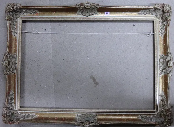 A 20th century gilt plaster swept frame, aperture 62cm x 92cm.  A3