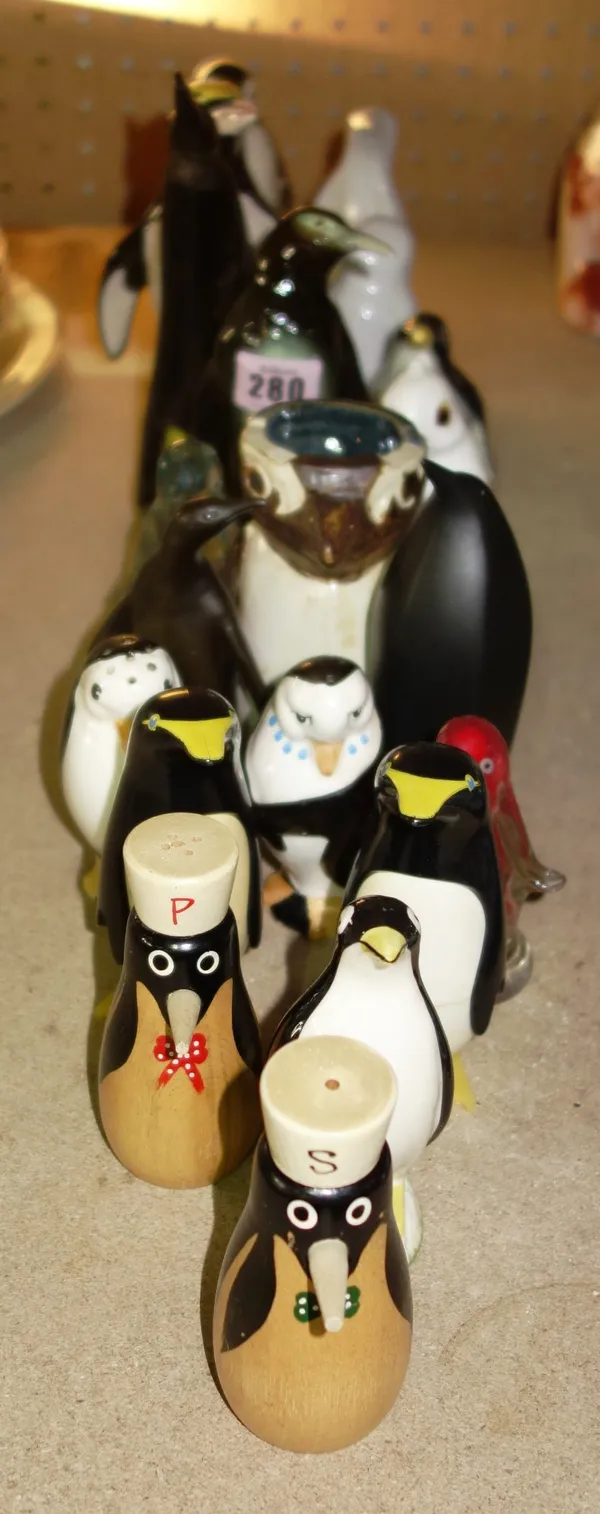 A quantity of 20th century ceramic models of penguins.   S1M