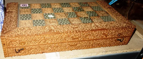 A profusely carved and inlaid Indian folding chess / backgammon board. CAB