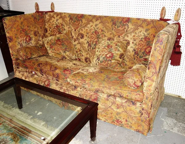 A 20th century orange floral upholstered Knole type drop end sofa.  DIS