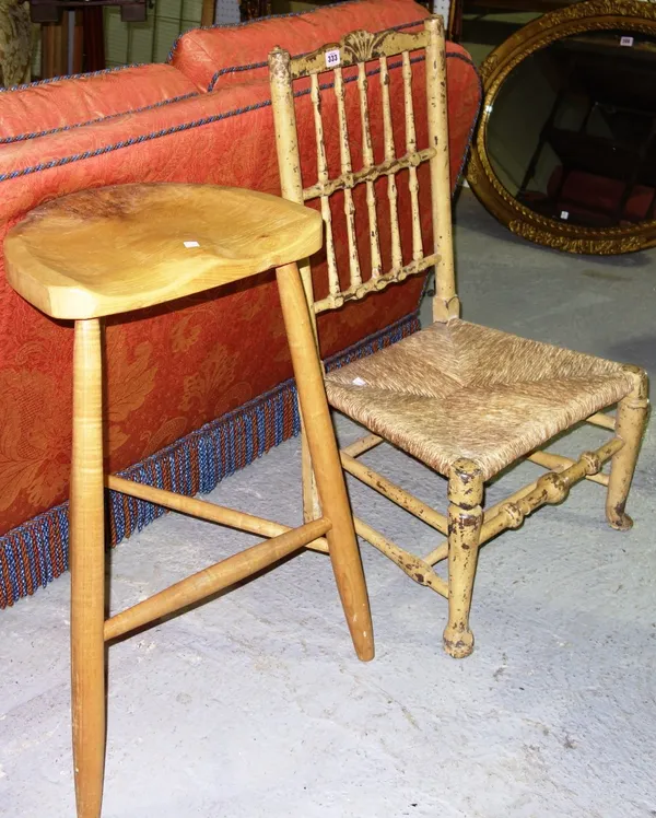 An 18th century yellow painted rush seated low armchair and an elm seated stool. (2)  C3