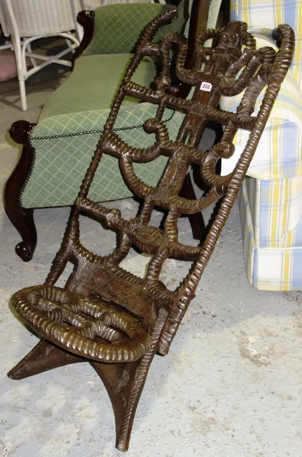 A 20th century carved hardwood low chair.  C7