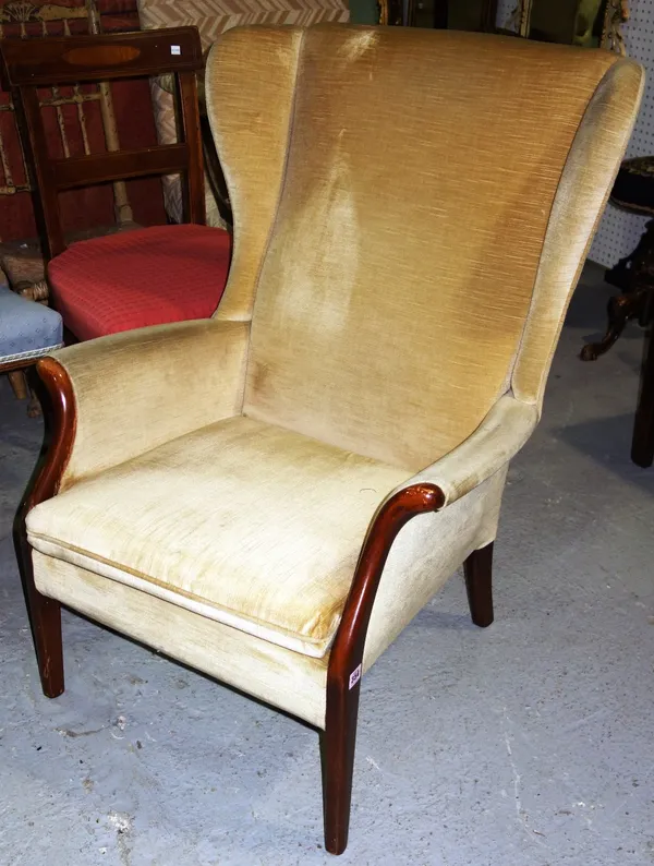 A 20th century Parker Knoll cream upholstered armchair. C4
