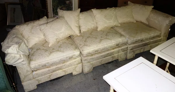 A 20th century cream upholstered three sectioned sofa.   L2