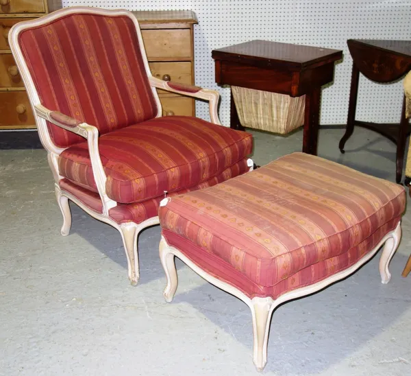 A modern beech fauteuil with matching stool. (2)   C2