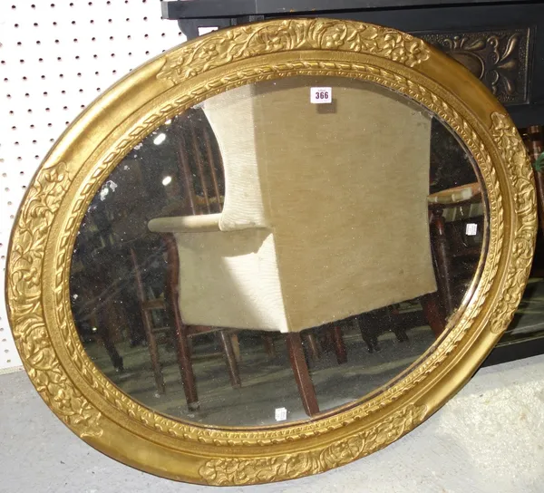 An oval gilt framed wll mirror, 87cm wide. A4