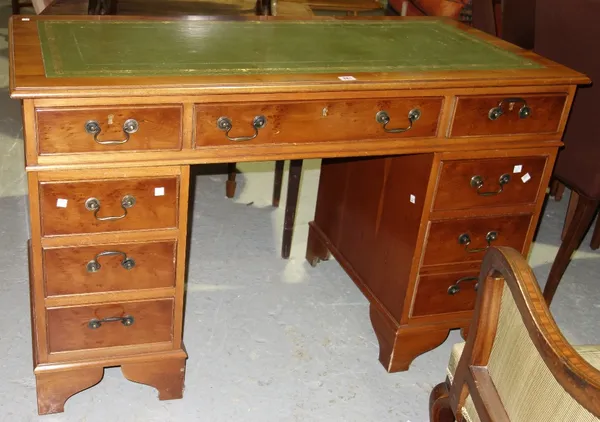 A reproduction yew twin pedestal desk with leather inset top, 123cm wide.  E2