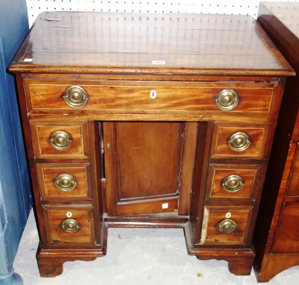 A 19th century mahogany kneehole desk, 70cm wide.   F1