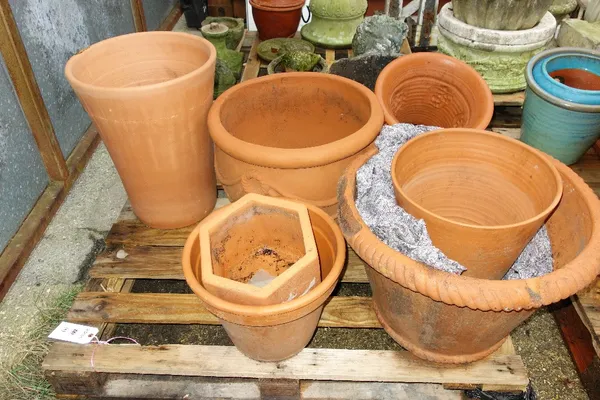 A group of nine large terracotta pots. (9)  OUT