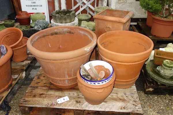 A group of nine mixed terracotta and jardiniere pots. (9)  OUT