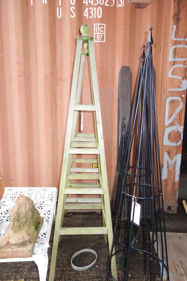 A pair of 20th century teak garden obelisks. (2)  OUT