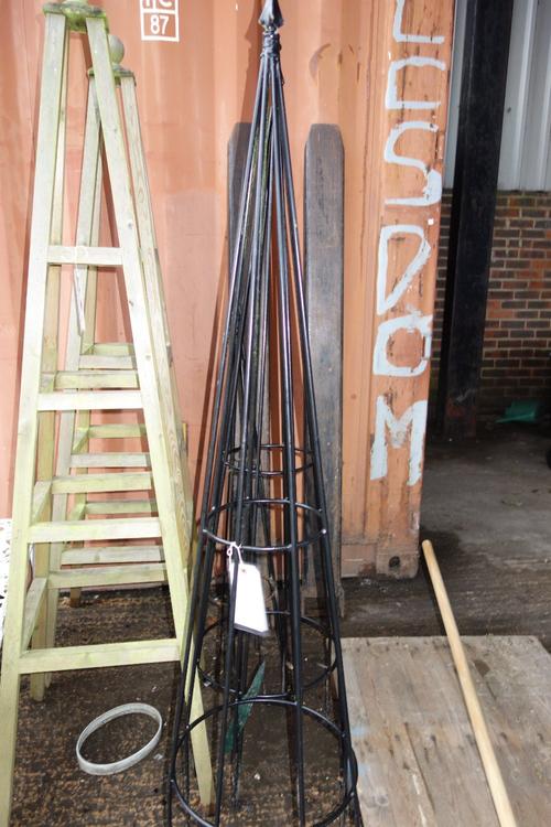 A set of three 20th century metal garden obelisks. (3)  OUT